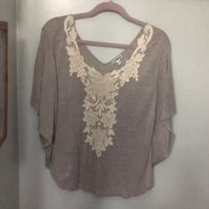 Poncho sweater with crochet detail